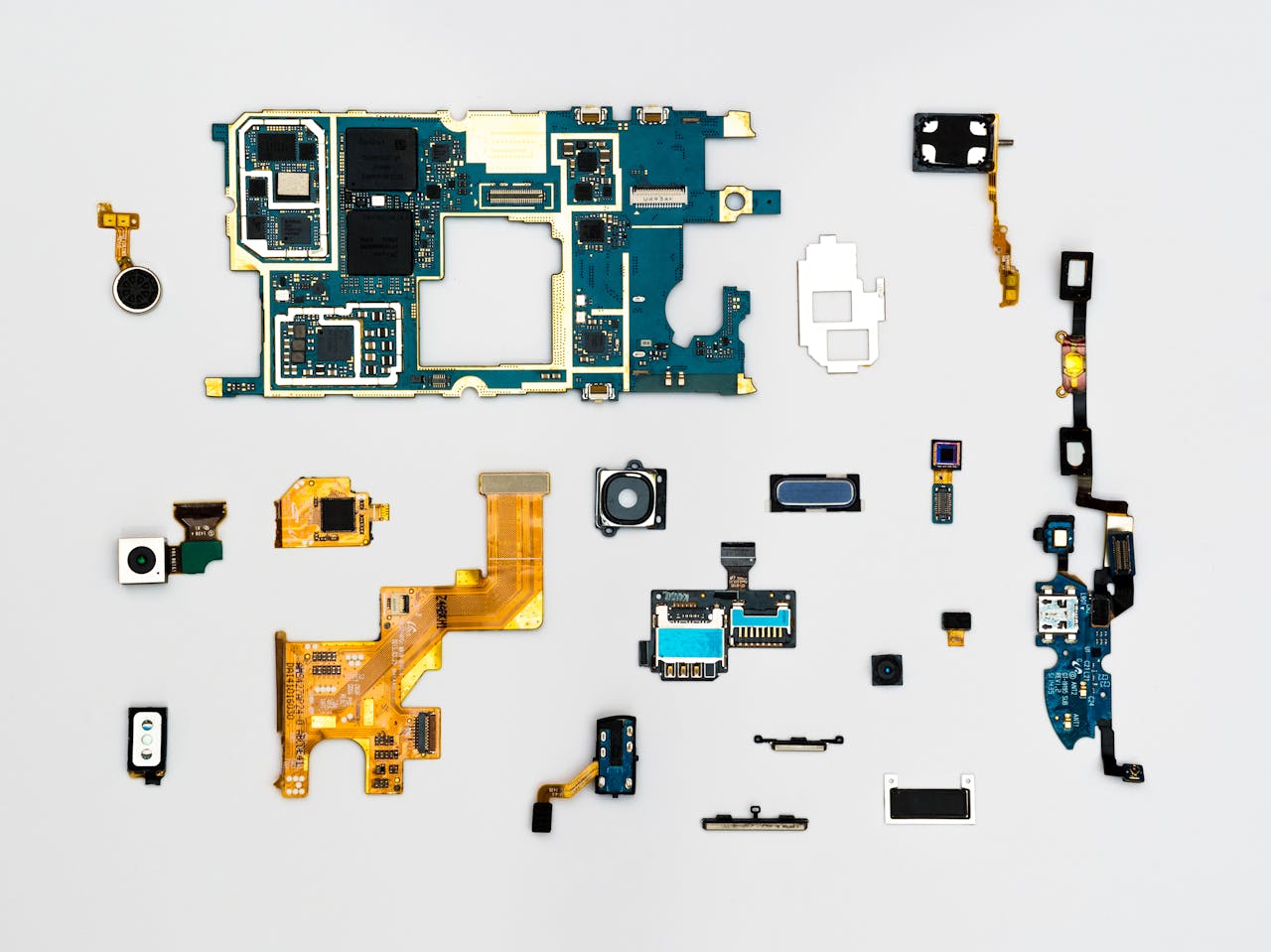 our-services-1 Exploded view of smartphone components showcasing intricate technological design.