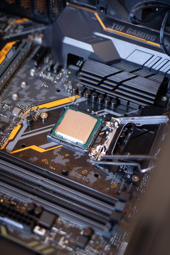 gallery-4 Detailed view of a motherboard with an exposed CPU, showcasing technology components.