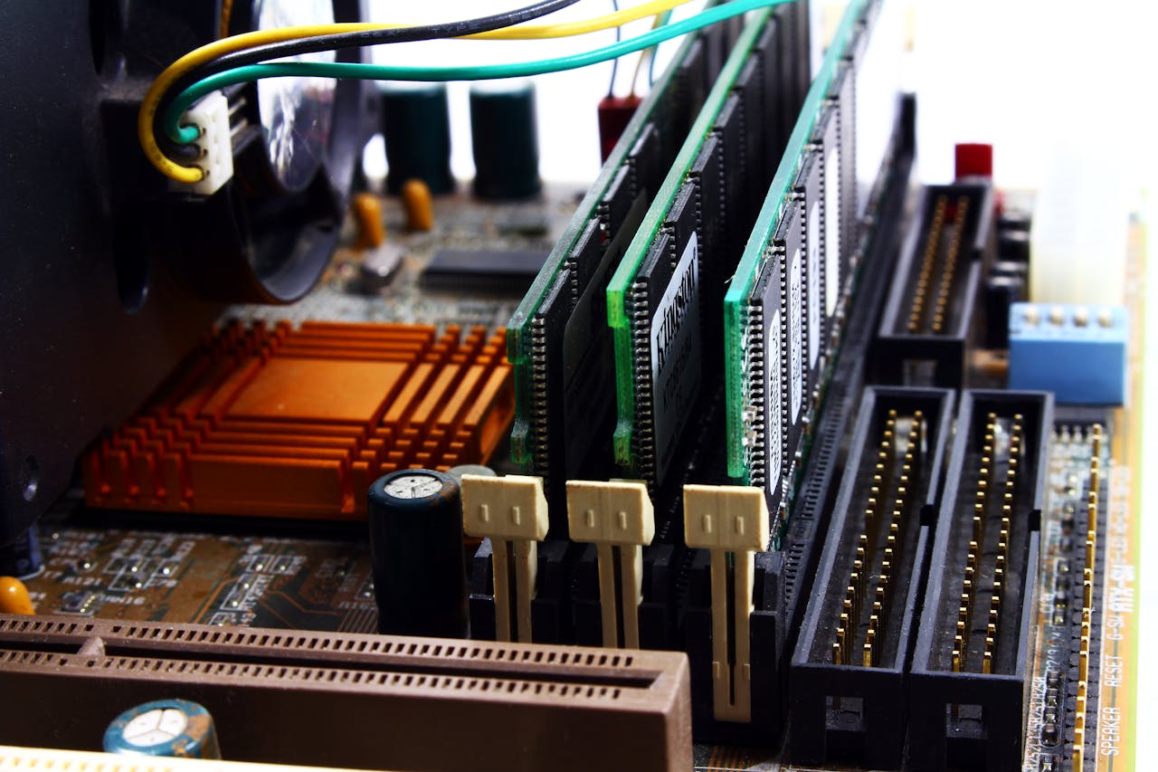 about-01 Detailed view of computer motherboard featuring RAM, chipset, and wiring.